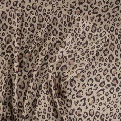 an animal print fabric with brown spots