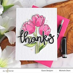 a card with pink flowers and the words thanks on it