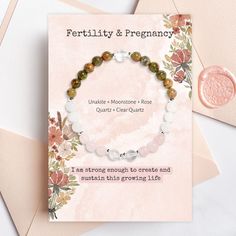 Meticulously crafted, this bracelet combines the gentle energies of Rose Quartz, Clear Quartz, Unakite, and Moonstone crystals, offering you unparalleled support and nurturing vibrations throughout this miraculous chapter of your life.Revered for its remarkable ability to promote a healthy pregnancy, Unakite harmonizes your body, fostering a state of calmness and centeredness as you embrace each stage of your journey. Its loving energy envelops you, providing a gentle, nurturing embrace that sup Healing Crystal Bracelet With Birthstone, Healing Crystal Bracelet With Birthstone And Round Beads, Adjustable May Birthstone Jewelry For Meditation, Spiritual Healing Crystal Bracelet With Birthstone, Spiritual Hypoallergenic Crystal Bracelet Gift, Hypoallergenic Crystal Bracelet For Spiritual Gift, Spiritual Beaded Birthstone Bracelets, Hypoallergenic Beaded Bracelets For Gift, Healing Hand-strung Rose Quartz Jewelry