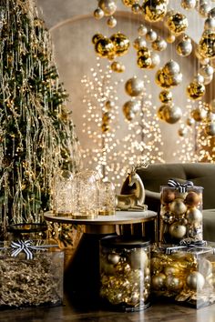 a living room filled with lots of christmas decorations next to a table covered in presents