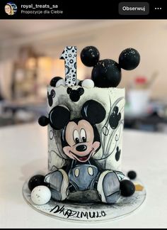 a mickey mouse birthday cake on a table