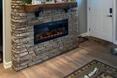 a stone fireplace in the corner of a room