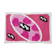 a pink and white rug with hearts on the front, one has black letters that spell out