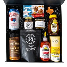 an open gift box filled with various condiments