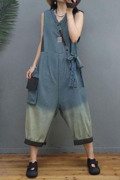 Item Code: 6600744796222 Material: Denim Cotton Collar: V Neck  Highlight: Pocket .Color Spliced .Breasted .Drawstring .Patchwork .Lace-up Season: Spring .Autumn .Summer Sleeveless Loose Fit Jumpsuits For Spring, Casual Baggy Sleeveless Jumpsuits And Rompers, Blue Sleeveless Denim Overalls, Sleeveless Blue Denim Overalls, Sleeveless Denim Blue Overalls For Summer, Casual Sleeveless Denim Blue Jumpsuits And Rompers, Sleeveless Medium Wash Summer Overalls, Sleeveless Medium Wash Overalls For Summer, Sleeveless Washed Blue Denim Jumpsuit With Pockets