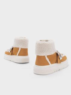 Look impeccably stylish while keeping warm when you step out in the Gabine fur-lined sneakers. Elevating the classic high-top silhouette, these shoes come with a warm brown, genuine leather finish and feature a fur lining for a cosy touch that adds texture, tactility, and contrast. On top of a functional lace-up design so that you can find your perfect fit, these shoes also come with a strap affixed with instantly recognisable silver-toned horseshoe buckles that make them an unmistakable member of the Gabine family. Leather Finish, Brown Sneakers, Charles Keith, Warm Brown, Keep Warm, High Top, High Top Sneakers, High Tops, Athletic Shoes