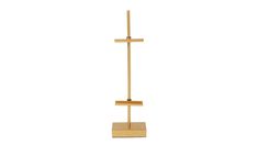 a wooden cross on a stand against a white background