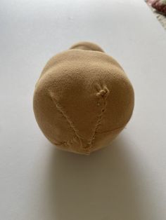 a small stuffed animal sitting on top of a white table