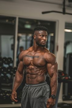 a man standing in front of a gym machine