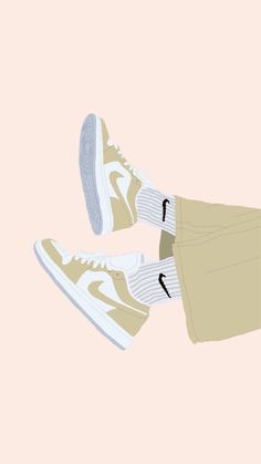 a pair of sneakers with white socks and beige pants on the bottom, in front of a pink background