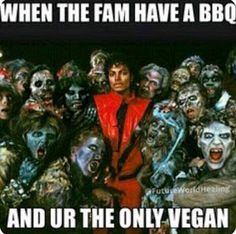 a man surrounded by zombies with the caption when the fam have a bbq and our the only vegan