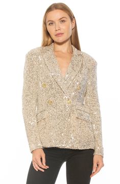 Glistening sequins add shimmer to a double-breasted blazer for a stand-out look. 27.5" length (size 2) Notched collar 90% polyester, 10% spandex Hand wash, dry flat Imported Model stats: 5'10" height, 32" bust, 25" waist, 36" hip. Model is wearing size 2. Glamorous Embellished Outerwear For Holiday, Glamorous Holiday Embellished Outerwear, Glamorous Evening Blazer For Spring, Spring Glamorous Embellished Blazer, Glamorous Sequined Blazer For Party Season, Glamorous Holiday Workwear Outerwear, Glamorous Fitted Blazer With Contrast Sequin Details, Glamorous Fitted Blazer With Contrast Sequin, Double-breasted Fall Party Blazer