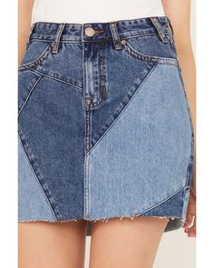 a women's jean skirt with fraying on the side