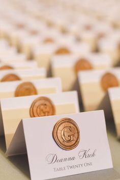 place cards are placed on top of each other in front of a row of rows of chairs