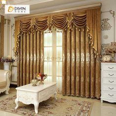 the living room is decorated in gold and white colors, with an elegant drapes