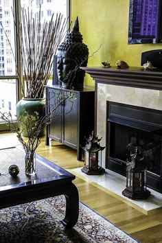 a living room filled with furniture and a fire place in front of a flat screen tv