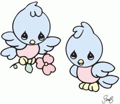 two little blue birds sitting next to each other on top of a white surface with pink flowers