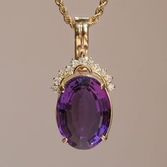 The deep purple of this vintage 14k yellow gold amethyst & diamond pendant just screams royalty. Materials - 14k Yellow Gold, Amethyst, Diamond Dimensions - 38.6mm x 18.7mm Note - Chain not included with purchase *Includes a pearl enhancer clasp on pendant Elegant Collectible Jewelry With Gemstone Accents, Elegant Jewelry With Gemstone Accents, Purple Prong Setting Formal Necklaces, Classic Oval Purple Jewelry, Amethyst Yellow Gold Jewelry Stamped 14k, Amethyst Jewelry In Yellow Gold Stamped 14k, Purple Diamond Pendant Jewelry, Oval Purple Jewelry With Gemstone Accents, Purple Oval Jewelry With Gemstone Accents