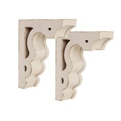 two white wooden brackets on a white background