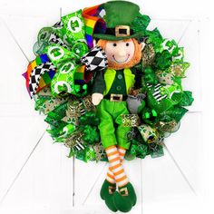 a st patrick's day wreath with a lepreite doll