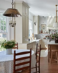 a kitchen with a table and chairs in it