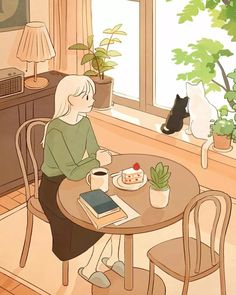 a woman sitting at a table in front of a window with a cat on the other side