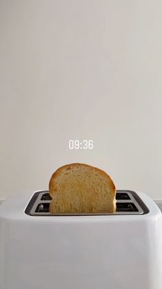 a white toaster sitting on top of a counter