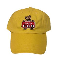 PRICES MAY VARY. 100% Cotton Hand Wash Only Vintage Piper Cub Logo Hat Brushed cotton twill cap with embroidered logo. Adjustable strap. Looks great to wear anywhere. Piper Cub, Cubs Hat, Logo Hat, Yellow Hat, Brushed Cotton, Hook Eye, Vintage Yellow, Baseball Caps, Buy Vintage