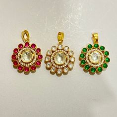 "Polish                   Stone ( Simulated )                       Design  \"22k yellow gold platting  \"         White polki            Minimalist & Light weight  \"22k yellow gold platting  \"         Ruby Polki               Minimalist & Light weight  \"22k yellow gold platting  \"         Emerald  Polki       Minimalist & Light weight  Made by Ray fineornates Jewellery from India - for your every type of occasion and mood!  HIGH QUALITY~ We make everything by hand and pay extra attention to Gold Kundan Pendant Necklace, Gold Kundan Necklace Pendant As Gift, Gold Kundan Round Pendant Necklace Gift, Gold Plated Kundan Pendant Necklace For Gift, Polki Pendent, Gold Pendent Set, Pendent Set, Gold Pendent, Victorian Pendants