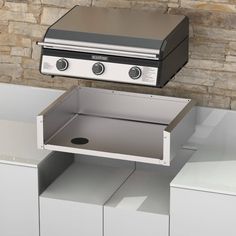 an outdoor bbq with two burners on the top and one open drawer below