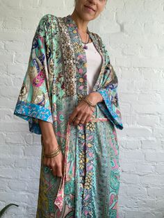 "This is one of a kind patchwork, upcycled silky robe Made free size with wrap tie closing and wide kimono sleeves Easy and fun to wear around the house or outside as a urban boho style, flowy kardigan with jeans and tshirt It is very comfy and feels soft and light the material is colourful indian saree silk made into this unique stylish over all MEAESURE free size length 55\" MATERIAL *saree silk, no lining More at https://www.etsy.com/shop/AltheaStores? CARE INSTRUCTIONS * Wash in warm water * Kaftan Dress Boho, Urban Boho, Patchwork Kimono, Maxi Skirts Summer, Funky Shirts, Skirts Flowy, Silky Robe, Summer Festival Outfit, Top Street Style