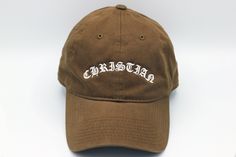 "JESUS SAVES Premium Dad Hat - with cross stitching on side Primary color - Hat Color Secondary color - Thread Color Moja Basics offers a variety of embroidered hats with designs that make our customers smile! Simply select a stylish design and choose a hat color that you love. Our hats are 100% cotton and have an adjustable buckle with an antique brass finish.  Product Description: 100% Cotton, Unstructured, Soft Crown Lining 6 eyelets Pre Curved Visor 6 Rows Stitching on Visor Garment Washed A Brown Curved Bill Hat With Embroidered Logo, Brown Embroidered Baseball Cap With Curved Brim, Brown Embroidered Baseball Cap, Brown Embroidered Curved Brim Baseball Cap, Brown Embroidered Snapback Baseball Cap, Adjustable Brown Hat With Embroidered Logo, Brown Adjustable Hat With Embroidered Logo, Brown Hat With Embroidered Logo, Embroidered Cotton Dad Hat With Flat Brim