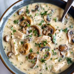 a bowl of soup with mushrooms and parsley