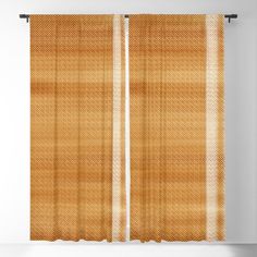 an orange and white checkered curtain hanging on a wall