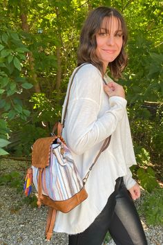 These backpacks are super cute! They are a mini size, have a bright multi-colored tassel, with removable and adjustable backpack straps, inside zipper and open pockets, and a top flap with a magnetic closure. * Dimensions: 9"L x 5"W x 10"H* Internal zip and slip pockets * Removable and adjustable backpack straps Casual Multicolor Leather Backpack For School, Casual Multicolor Leather Backpack, Casual Multicolor Leather Backpack For Daily Use, Multicolor On-the-go Backpack With Adjustable Strap, Multicolor Backpack With Adjustable Strap For On-the-go, On-the-go Multicolor Backpack With Adjustable Strap, Boho Backpack, Backpack Straps, Magnetic Closure