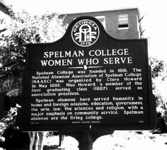 a black and white photo of a sign in front of a building that says spielman college women who serve