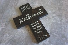 a wooden cross with the words, be kind to god and nathaniie may you grow in the light of god's love