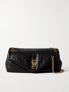 SAINT LAURENT's textured-leather 'Calypso' bag looks and feels so sumptuous. The gold-tone chain strap matches the interlocking 'YSL' plaque for a touch of classic Parisian glamour. It's padded for a little extra structure and has enough space inside for your compact, mints and phone. Saint Laurent Waist Bag, High-end Textured Leather Shoulder Bag For Everyday Luxury, Designer Evening Bags With Grained Texture, Black Evening Bags With Grained Texture, Leather Shoulder Bag With Grained Texture For Business, Business Leather Shoulder Bag With Grained Texture, Luxury Black Bags With Grained Texture, Designer Bags With Grained Texture For Everyday Use, Luxury Grained Texture Shoulder Bag For Business