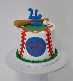 a birthday cake with a baseball and bat on it