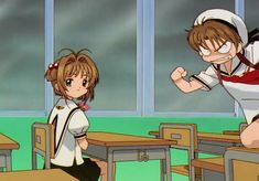 two anime characters are sitting at desks and one is pointing to the other side