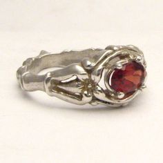 "Handmade Solid Sterling Silver Red Garnet Bone Ring 6x4mm .5ct Sizing and shipping is ALWAYS FREE with a 14 day \"No Questions Asked\" return policy. *In the notes section of your order, please specify ring size.* This ring is made with real gems. I made it myself, so if you see a setting you like and want a different gem in it, I can put in another one as they are not finished. I can probably do it for the same price or real close. I can make these either in gold or sterling silver; just email Classic Red Rings For Valentine's Day, Sterling Silver Red Ruby Promise Ring, Garnet Ruby Ring Gift, Red Garnet Rings For Valentine's Day, Red Solitaire Ring For Promise, Garnet Ruby Ring As Birthstone Gift, Red Solitaire Promise Ring, Promise Ruby Ring In Sterling Silver, Ruby Ring As Birthstone Gift