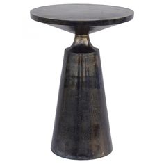 a small round table with an iron base and black pattered paint on the top