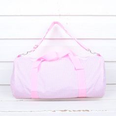 This kid's weekend duffel bag comes with a shoulder strap for easier travel and a side zipper pocket to hold smaller items. So cute for a trip to grandma's house or sleepover with friends. Add a monogram to personalize this perfect travel accessory! Measurements 20.5" x 16" Maximum monogram width is 4 inch. Please note monogram sizing varies due to monogram style. Preppy Gingham School Bag, Preppy Gingham Travel Bags, Rectangular Gingham Travel Bags, Preppy Gingham Bags For Everyday Use, Preppy Gingham Bag For Everyday, Preppy Gingham Bags For Everyday, Preppy Gingham Everyday Bag, Weekend Duffle Bag, Cute Colors