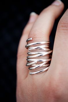 This item is made to order and will ship after 7-10 business days. That time does not include holidays, weekends or shipping time! This is a gorgeous, trend-setting ring made of pure, half round (D shaped) sterling silver metal. This ring is actually made of three individual rings that you stack on top of each other to create the illusion of one single extra wide ring! I got the idea for this listing the other night when I stacked three of my popular Going in Circles rings on top of each other. Modern Twist Sterling Silver Open Ring Jewelry, Adjustable Hand Wrapped Sterling Silver Rings, Silver Bypass Ring With Modern Twist, Modern Twist Open Ring In Sterling Silver, Minimalist Hand Wrapped Promise Ring, Sterling Silver Jewelry With Ring Detail, Modern Twist, Sterling Silver Jewelry With Modern Twist, Modern Twist Sterling Silver Jewelry With Ring Detail, Stackable Sterling Silver Rings With Modern Twist