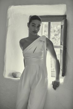 With a just-so bow falling gracefully from one shoulder and flawless tailoring, this modern, yet utterly romantic jumpsuit has endless allure. White Reception Dress, Wedding Reception Dresses, Promenade Dress, White Weddings Reception, Second Dress, Reception Dresses, Bridal Jumpsuit, Wedding Reception Dress, Reception Dress