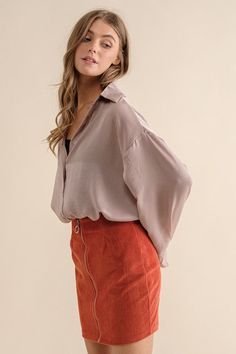 - Collared button down top- Super soft light satin fabric- Model is 5' 9" 32-24-34 and wearing a Small Style: casual Print / Pattern: solid Silhouette: drop shoulder Fit: oversized Embellishment: cuffs Neck Line: collar Sleeve: long sleeves Length: hip Closure: button down Lining: no Made In: ChinaFabric Contents: 100% PolyesterSize Measurement (inch): S: 48.0 (Bust), null (Waist), 47.0 (Hips), 25.5 (Length) M: 50.0 (Bust), null (Waist), 49.0 (Hips), 26.0 (Length) L: 52.0 (Bust), null (Waist), 51.0 (Hips), 26.5 (Length) Fall Button-up Blouse, Versatile Solid Color Fall Shirt, Trendy Spring Blouse With Cuffed Sleeves, Trendy Blouse With Cuffed Sleeves For Spring, Versatile Button-up Shirt For Fall, Trendy Fall Blouse With Shirttail Hem, Trendy Button-up Blouse With Cuffed Sleeves, Versatile Fall Button-up Shirt, Trendy Fall Blouse With Cuffed Sleeves