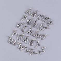 26 Letters Sterling Silver Charm Necklace Pendant Material: 925 sterling silver Size: 3.1cm*1.8cm Weight: 1.5g-3.5g Length: 2.3cm-2.7cm * We guarantee 100% genuine 925 Sterling Silver, If not we will refund your money. Care Instruction : 1. Avoid contact with all liquids and chemicals, such as perfume, sea water, mayonnaise, ammonia, chlorinated pool water, hair spray and sweat. Contact with these substances will increase the rate at which tarnishing occurs. 2. Ensure your jewellery is not expos Sterling Silver Charm Necklace, Alphabet Charm, Alphabet Necklace, Letter Charm, Charm Necklace Silver, Block Lettering, Letter Pendants, Letter Charms, Pendant Silver