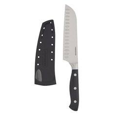 a large knife with black handles and white dots on the blade is next to a smaller knife