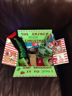 the grinch stole christmas and brought it to you book on a brown leather couch