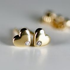 Diamond Puffy Heart Earrings, 14k Solid Gold Diamond Studs, Dainty Heart Studs, Minimalist Studs Earrings  Material;   14k solid gold puffy heart stud earrings Earrings measure, length 5mm, width 5mm Round Diamond: 2 pcs (for the pair) Total carat weight 0.06 ctw   Diamonds are G-H color, SI clarity scale. * All orders are elegantly packaged in small gift boxes with extra gift pouches for protection, making them perfect for gifting..  EXTRA GIFT WRAPPING SERVICE  Make your gift truly unforgettab Gold Diamond Studs, Minimalist Earrings Studs, Topaz Jewelry, Minimalist Studs, Aquamarine Jewelry, Earrings Christmas, Garnet Jewelry, Christmas Gift For Her, Puffy Heart